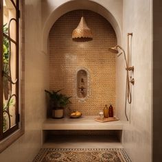 a bath room with a shower and a rug on the floor in front of it