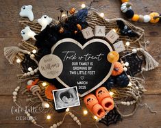 a heart shaped frame is surrounded by halloween decorations