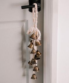 bells hanging from the side of a door