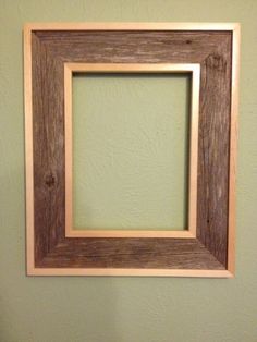 a wooden frame hanging on the wall