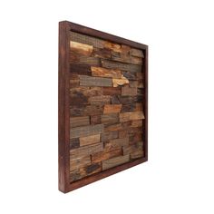 a wooden wall hanging on the side of a white wall with wood planks in it