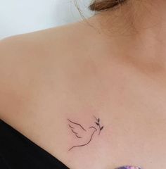 a woman with a small tattoo on her chest