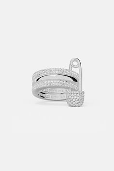 This ring is handcrafted from sterling silver and microset with white cubic zirconia. The inside is also microset with white cubic zirconia to form the words Love, Smile and Bonheur in Morse Code secret language. The meaning is also engraved inside.2-year worldwide warranty Material: Sterling silver, white cubic zirconia All our products are handcrafted and microset by hand in our ateliers Color: Silver Size: Choose your size from 4.5 to 9 Apm Monaco Rings, Safety Pin Ring, Pin Ring, Code Morse, Code Secret, Apm Monaco, Diamond Gift, Morse Code, Metal Shop