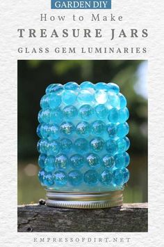 a blue glass vase sitting on top of a wooden table with text overlay that reads how to make treasure jars