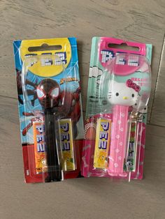 two hello kitty pencils and an eraser are in the package on the table