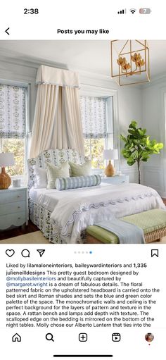 a bed room with a neatly made bed next to two windows and a potted plant