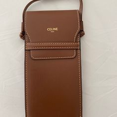 Brand New Celine Pouch In Lambskin Leather/Calfskin Lining -Crossbody For Sunglasses Or Iphone (My Iphone 11 Pro Max Fits Perfectly Inside) -Comes With Celine Black Cloth For Cleaning Sunglasses 100% Authentic- Does Not Comes With Duster Size:10x19x2cm Luxury Brown Phone Bag With Cell Phone Pocket, Elegant Brown Crossbody Phone Bag, Classic Brown Pouch Phone Bag, Luxury Brown Shoulder Bag With Card Slots, Luxury Brown Phone Bag For Daily Use, Elegant Brown Phone Bag For Everyday Use, Elegant Brown Phone Bag For Everyday, Elegant Crossbody Phone Bag With Interior Card Slots, Elegant Rectangular Phone Bag With Card Slots