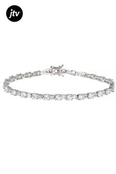 Bella Luce �� white diamond simulant 13.91ctw round and baguette, rhodium over sterling silver tennis bracelet. Measures approximately 7.5"L and 8"L x 0.13"W and has a hidden box closure. The diamond equivalent weight is 7.54ctw. Silver Round Diamond Bracelet With Baguette Diamonds, Silver Baguette Diamond Tennis Bracelet, Silver Tennis Bracelet With Baguette Diamonds, Silver Cubic Zirconia Bracelet With Baguette Cut, Silver Cubic Zirconia Bracelets With Baguette Cut, White Tennis Bracelet With Baguette Cubic Zirconia, Silver Tennis Bracelet With Baguette Diamonds As A Gift, Silver Tennis Bracelet, Diamond Simulant