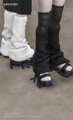 two pairs of legs with socks and shoes attached to them