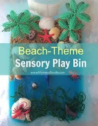 there is a sign that says beach - theme sensory play bin