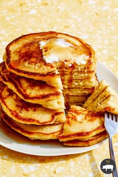 a stack of pancakes with butter on top