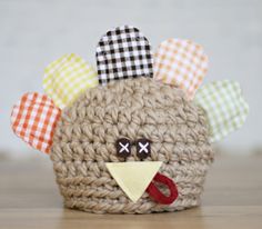 a small crocheted animal made to look like a turkey with ears and eyes