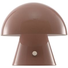 the mushroom lamp is brown and has a white light on it's side,