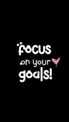 the words focus on your goals are written in white and pink letters, against a black background