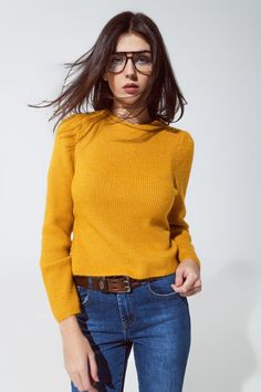 Embrace comfort and style with our Cozy Mustard Yellow Chunky Ribbed Jumper, a versatile addition to your wardrobe that's perfect for various occasions. Vibrant Mustard Yellow Color: Brighten up your day with the sweater's eye-catching mustard yellow hue, a color that complements a wide range of skin tones and adds a cheerful touch to any outfit. Comfortable Chunky Ribbed Knit: Crafted from a cozy blend of 74% Acrylic, 22% Polyester, and 4% Elastane, this jumper offers both warmth and comfort, m Cozy Sweater With Ribbed Neckline For Work, Cozy Stretch Tops For Work, Soft Knit Sweater For Work, Winter Workwear Sweater With Ribbed Neckline, Yellow Turtleneck Top For Winter, Yellow Turtleneck Sweater For Fall, Fitted Yellow Turtleneck Sweater, Yellow Winter Sweater For Workwear, Yellow Winter Sweater For Work