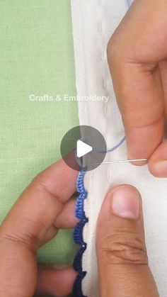 someone is stitching something on the side of a piece of cloth