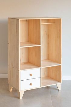 an open bookcase with two drawers on one side and three drawers on the other