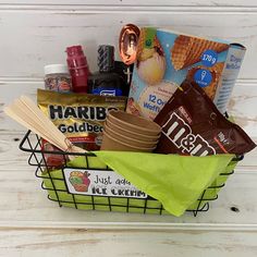 a basket filled with lots of food sitting on top of a table