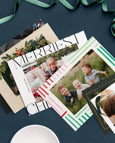 christmas cards with ribbon on table next to paper plate and other holiday greeting card designs