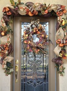 a front door with a wreath on it