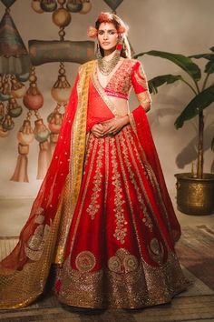 Red lehenga featuring zardozi embroidered chand phool, floral motifs, embellished with sequins and patchwork. Comes with separate can can, embroidered blouse, outer patchwork embroidered jaali motif dupatta and inner kiran lace lined dupatta. - Aza Fashions Red Tilla Choli For Navratri, Red Bollywood Choli With Tilla Detail, Bollywood Style Red Choli With Tilla Details, Red Tilla Saree For Reception, Red Tilla Choli For Wedding, Red Choli With Tilla For Wedding, Red Wedding Choli With Tilla Detailing, Red Tilla Lehenga For Navratri, Red Dupatta With Tilla Detail