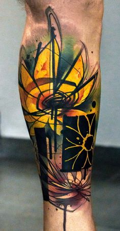 an artistic tattoo on the leg of a man