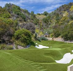 an artificial golf course in the mountains