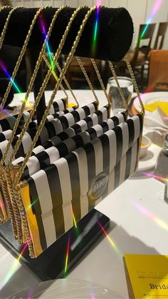 a black and white striped purse sitting on top of a table