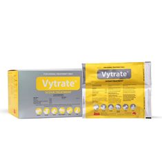 a package of vitrate sitting on top of a white table next to a yellow box