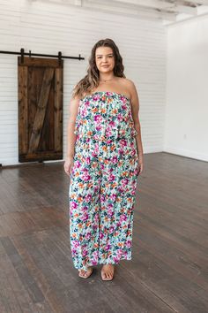 Achieve party perfect vibes every time you slip into our Life of the Party Floral Jumpsuit. With a bold floral pattern, boxy pant, and layered strapless bodice, this jumpsuit is designed to fit effortlessly and let your style shine! The elastic neckline and waistband make it easy to slip on and off, while the airy and lightweight fabric will help you feel comfortable all day and night. Ready to be the life of the party? Lightweight Woven Fabric No Stretch Elastic Back Waistband Cased Elastic Nec