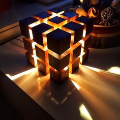 an illuminated cube sitting on top of a table