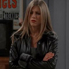 an image of a woman with her arms crossed in front of the tv screen that says friends