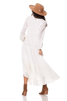 The Serenity Embroidered Maxi Dress Natural is a one-of-a-kind piece that will make you stand out in any crowd. Made from 100% Indian cotton, this dress is not only comfortable but also exudes a natural and effortless beauty. The intricate embroidery on the dress adds a touch of elegance and uniqueness, making it a must-have for any fashion-forward individual. The dress comes in two sizes, Small/Medium and Medium/Large, ensuring a perfect fit for sizes 2 to 10. The long sleeves provide coverage Chic Embroidered Daytime Dress, Chic Embroidered Daywear Dresses, Elegant Embroidered Dress For Day Out, Flowy Floral Embroidered Midi Maxi Dress, Flowy Floral Embroidered Maxi Dress, Flowy Midi Maxi Dress With Floral Embroidery, Chic Embroidered Midi Dress For Daywear, Spring Midi-length Embroidered Dress With Chikankari, Bohemian Midi Dress With Lace Trim For Day Out