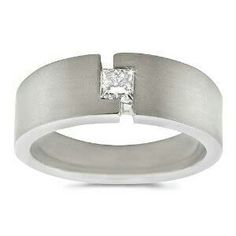 a white gold ring with a princess cut diamond