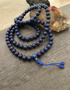 This Lapis Lazuli Mala necklace has a beautiful blue tone that will be easy to match your everyday outfits and keep you calm and grounded if you use it while meditating. Its a unique decor item also. A perfect gift for a yoga lover, or someone that loves stones. You can use it as a necklace or wrap it around the wrist and becomes a bracelet. The Mala necklace has a drop length of 43cm- 17 inch. A most have addition to your jewelry collection. ⚡️Join Akashi's VIP list for early bird discount acce Holistic Beaded Bracelets With Round Beads For Meditation, Adjustable Spiritual Beaded Necklace For Meditation, Adjustable Spiritual Beaded Necklaces For Meditation, 8mm Holistic Healing Beads, Holistic 8mm Beads For Healing, Holistic 8mm Healing Beads, Healing Lapis Lazuli Beaded Necklaces, Adjustable Lapis Lazuli Beaded Necklace With 8mm Beads, Spiritual Beaded Necklace With 108 Adjustable Beads