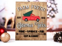 a wooden sign that says farm fresh christmas trees pine - spruce fir cut & carry