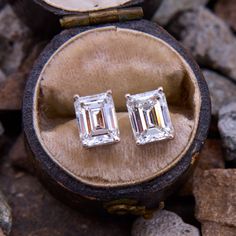 This attractive pair of diamond stud earrings are each accented with one (1) emerald cut diamond set into a four-prong setting. The earrings are finished with friction backs and posts for pierced ears. Luxury Emerald Cut Diamond Earrings For Formal Occasions, Luxury Emerald-cut Diamond Earrings For Formal Occasions, Elegant Platinum Emerald Cut Diamond Earrings, Elegant Emerald Cut Platinum Diamond Earrings, Octagon-shaped Diamond Earrings For Formal Events, Luxury 14k Gold Emerald Cut Earrings, Platinum Baguette Cut Diamond Earrings For Anniversary, Octagon Diamond Earrings For Formal Events, Octagon Diamond Earrings For Formal Occasions