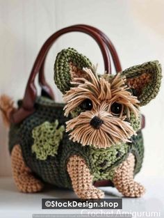 a crocheted bag with a small dog on it's front and side