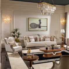 a living room filled with furniture and a chandelier