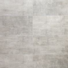 a large gray tile wall with no one in it