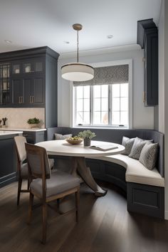 a kitchen with a table, bench and chairs next to a window in the corner