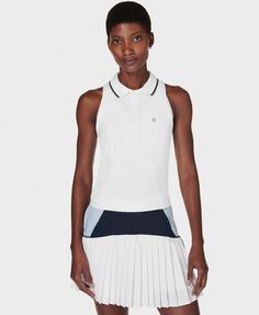 Our new performance top for days on the court. Sweat-wicking, anti-bacterial fabric keeps you cool and dry. Loose fit with classic polo collar and half zip. Mesh panel at the back for extra breathability. Flattering seamline details. Front length: 51cm / 20". Model wears size S and is 178cm/5'10" tall. Style Code: SB9291Colour: White Tennis Tank Tops, Match Point, Running Leggings, Sweaty Betty, Vest White, Performance Outfit, Mesh Panel, The Court, Polo Collar