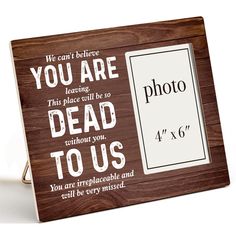 a wooden frame with the words, you are dead to us and an image on it