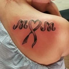 a woman with a tattoo on her shoulder that says love and an infinite ribbon in the shape of a heart