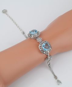 Genuine Blue Topaz Silver Filigree Bracelet, 925 Sterling Silver Authentic Natural Blue Topaz Artisan Crafted DGS Bracelet 7 inches + 2 inches Extender, Jewelry Gifts Boxed for Her Material: 925 Sterling Silver 2 Genuine Blue Topaz Gemstones: 12 mm x 12 mm each, square, Total Carat weight: 15 Fits wrists 7-9 inches Bracelet Length: 7 inches + 2 inches Extender. Total Length: 9 inches Bracelet Width: 0.80 inches This will come in a designer pouch, put in gift box and a romance card Free Domestic Filigree Bracelet, Fine Silver Jewelry, Silver Filigree, Topaz Gemstone, Artisan Craft, Jewelry Gift Box, Chain Link Bracelet, Fine Silver, Link Bracelets