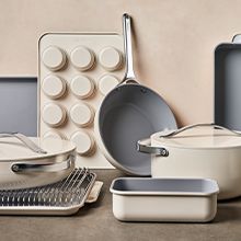 an assortment of pots and pans sitting on a table