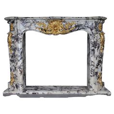 an ornate marble fireplace surround with gold and silver decorations on it's sides, isolated against a white background