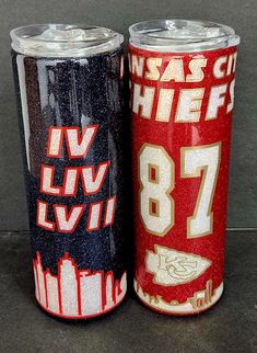 two red and black tumblers sitting next to each other