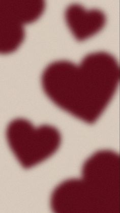 several red hearts are arranged in the shape of heart shapes on a white and maroon background