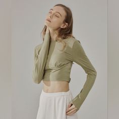 Nwt Long Sleeve Solid Fitted Crop Top (Eagle) - Nap Loungewear This Ultra Soft, Slim Fit, Crop Top Features A Wide Round Front Neckline With A Low Scoop/Open Back. It Also Has A Unique Elastic Band Around The Back To Secure The Top In Place. 'Eagle' Color Is A Pretty Neutral Olive/Muted Green Hue. Cute For Exercise Or Casual Wear! Size Small New With Tags 35.6% Viscose, 26.8% Acrylic, 26.8%Cotton, 10.8% Spandex Please See Actual Product Photos For Garment Color And Detail, Which May Vary Slightl Fitted Cotton Khaki Tops, Fitted Khaki Cotton Tops, Casual High-stretch Long Sleeve Top For Spring, Casual High Stretch Long Sleeve Top For Spring, High Stretch Casual Long Sleeve Top For Spring, Khaki Fitted Long Sleeve Top, Stretch Khaki Long Sleeve Top, Khaki Long Sleeve Tops For Spring, Fitted Khaki Tops With Crew Neck